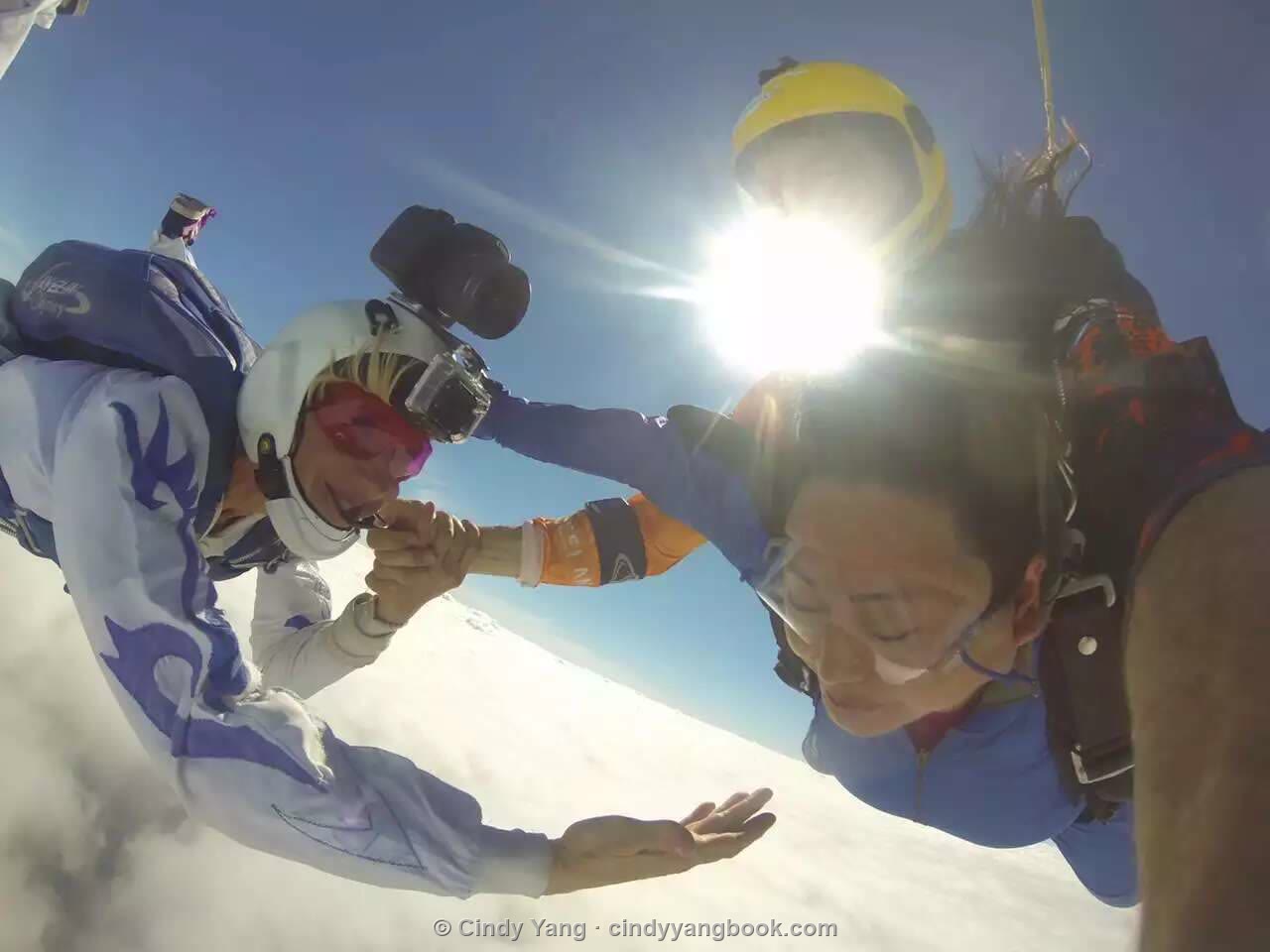 Cindy skydiving in free fall, reaching out