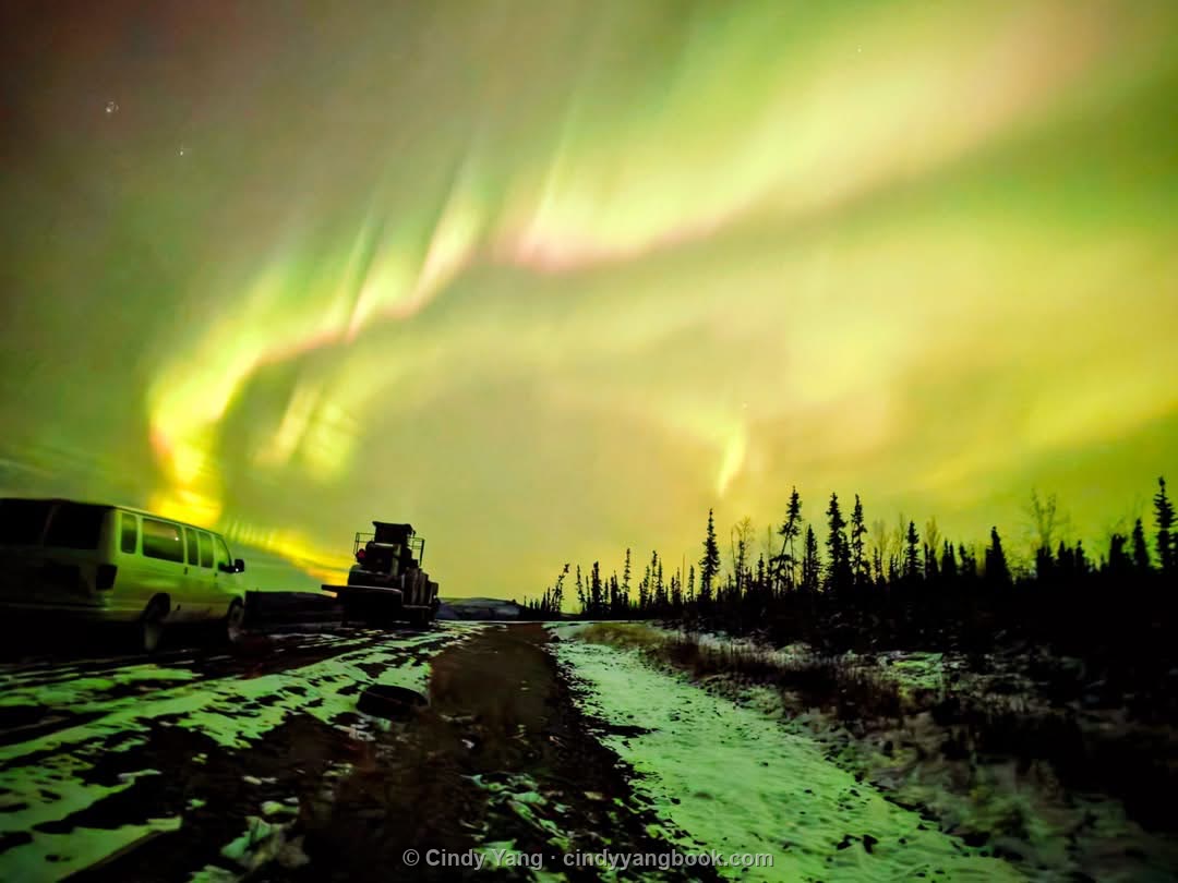 Northern lights over an Alaska road
